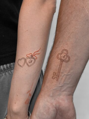 Matching father daughter tattoos