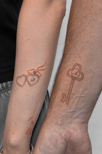 Matching father daughter tattoos